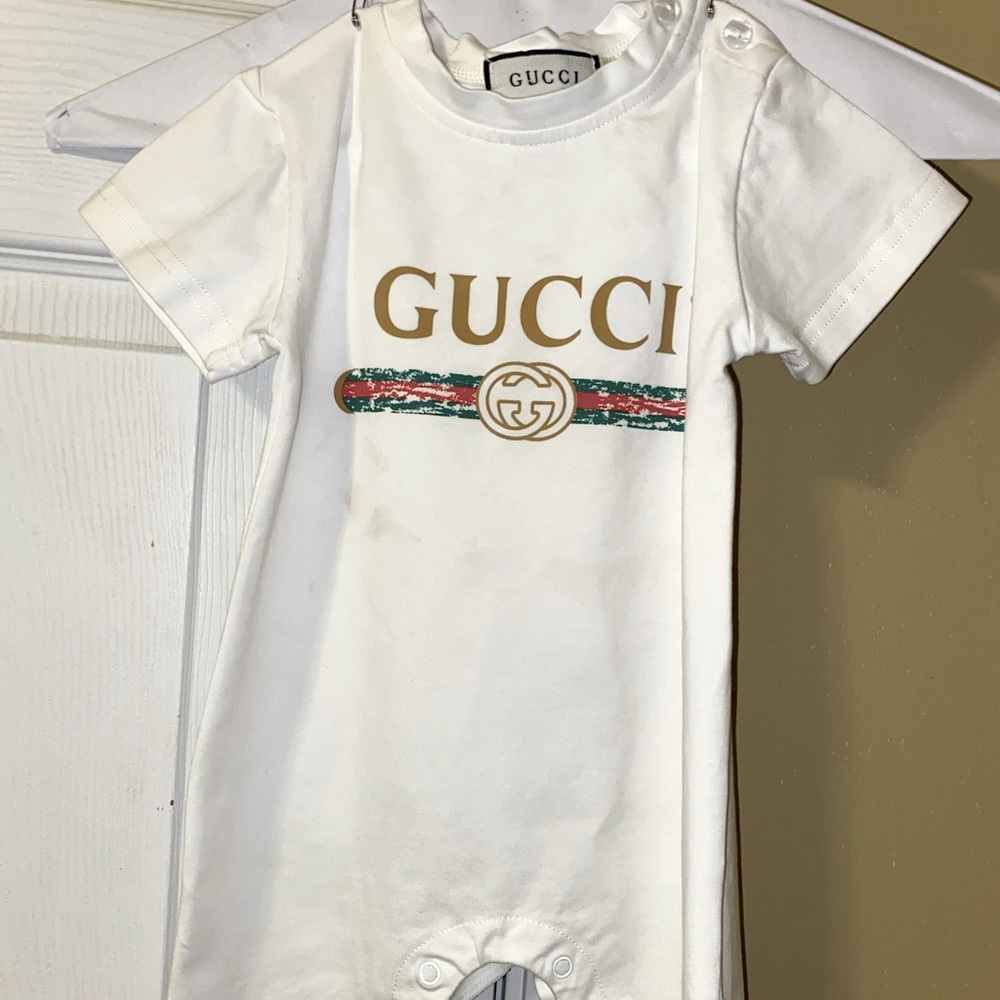 Gucci onesie.